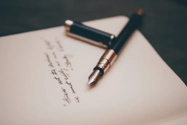 An open pen on a paper